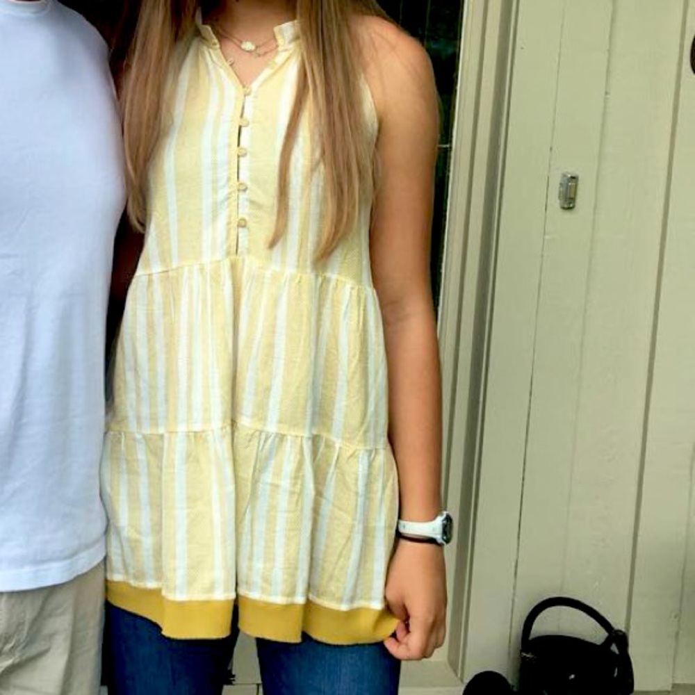 A yellow and white stripped sleeveless shirt/dress